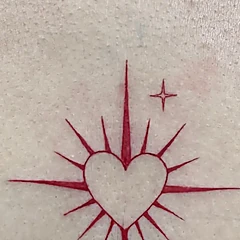 Corazón con destellos en línea fina roja